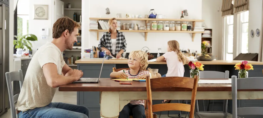 family sitting in kitchen